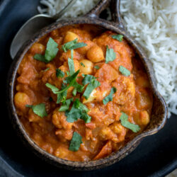 This delicious (and Vegan!) Chickpea Tikka Masala recipe hits the spot when you're craving Indian food. Serve it up over rice and garnish with plenty of fresh cilantro!